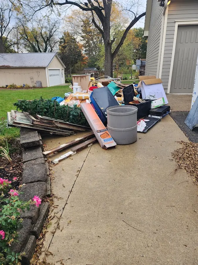 Dumpster being loaded with debris for Commercial Dumpster Rental in Takoma Park